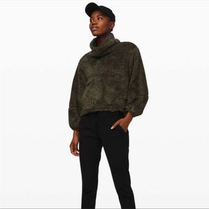 Lululemon Warm Restore Sherpa in dark olive.